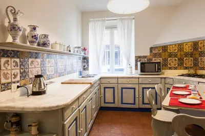 a kitchen with a counter and a table in it at Casa Tranquilli in Rome