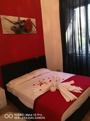a bedroom with a bed with a bunch of confetti at Trastevere four seasons Glorioso in Rome