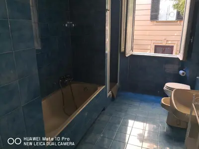 a bathroom with a tub and a toilet and a sink at Trastevere four seasons Glorioso in Rome