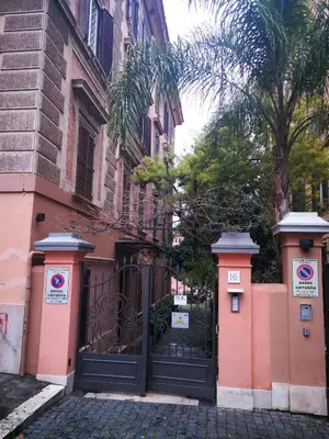 an entrance to a building with a black gate at Trastevere four seasons Glorioso in Rome