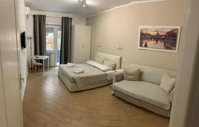 a living room with a couch and a couch and a table at Residenza Romana Vaticana in Rome