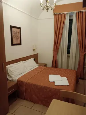 a hotel room with a bed with two towels on it at Appartamento Privato Simone in Rome