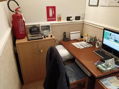 an office with a desk with a laptop computer on it at Appartamento Privato Simone in Rome