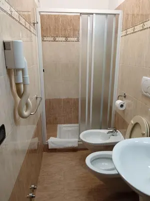 a bathroom with a toilet and a sink and a shower at Appartamento Privato Simone in Rome