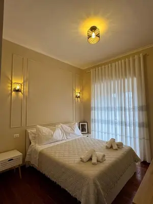 a bedroom with a bed with two towels on it at La Muraglia Di San Pietro in Rome