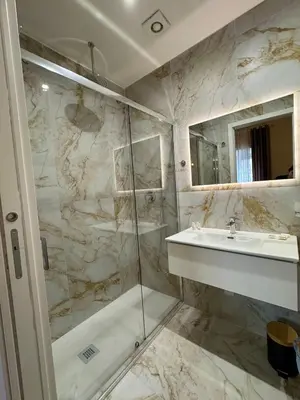 a bathroom with a sink and a shower at La Muraglia Di San Pietro in Rome