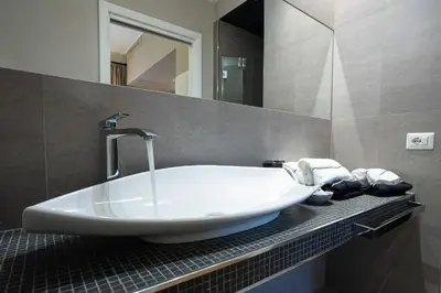 a bathroom with a large white tub on a counter at Cardilli Luxury Rooms in Rome