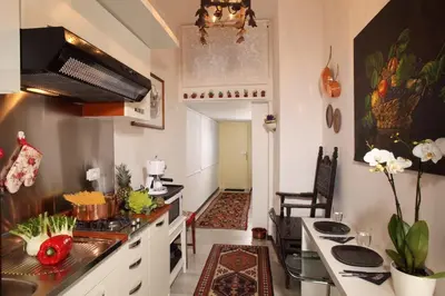a kitchen with a sink and a counter top at Roma Central Guest House in Rome