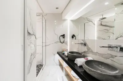 a bathroom with two sinks and a shower at Loft Spazio Panieri Unique place in Trastevere in Rome
