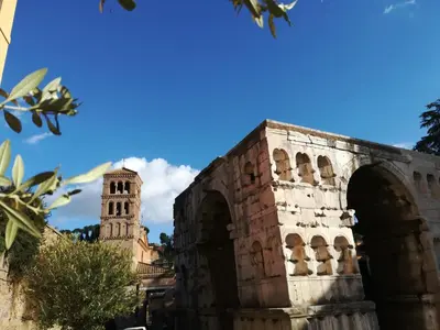a building with a clock tower in the background at Foro Romano Palatino View Relais in Rome