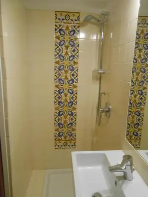 a bathroom with a shower and a sink and a tub at Foro Romano Palatino View Relais in Rome
