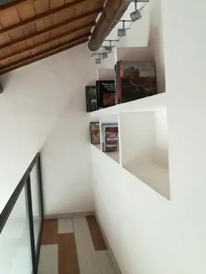 a staircase in a house with white walls at Foro Romano Palatino View Relais in Rome