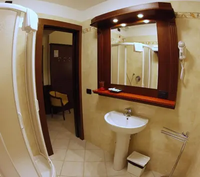 a bathroom with a sink and a mirror at Domus Augusta in Rome