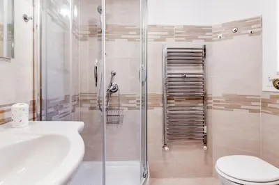 a bathroom with a shower and a toilet and a sink at Giulia's holidays in Rome