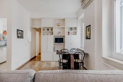 a living room with a couch and a table at Giulia's holidays in Rome