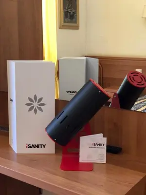 a desk with a box and two objects on it at Hotel Bolognese in Rome