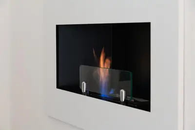 a fireplace with a fire inside of it at Domus Quiritum Elite, Vatican luxury apartment in Rome