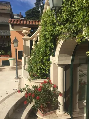a building with flowers on the side of it at B&B VILLINO MARGHERITA in Rome