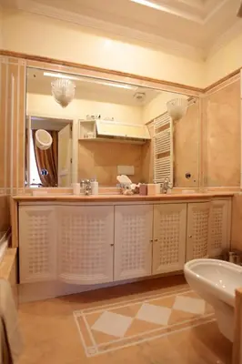 a bathroom with a sink and a mirror at B&B VILLINO MARGHERITA in Rome