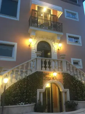 a building with a staircase and a balcony at B&B VILLINO MARGHERITA in Rome
