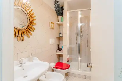 a bathroom with a toilet and a sink and a shower at L'Agata (Trastevere) in Rome