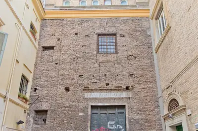 a brick wall of a building with a window at L'Agata (Trastevere) in Rome