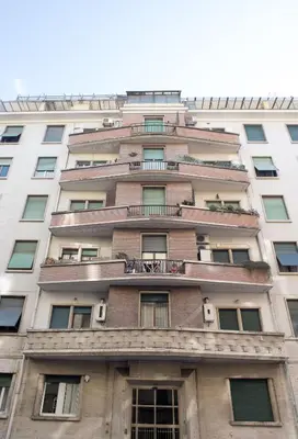 a tall white building with windows at Suite GG in Vatican in Rome