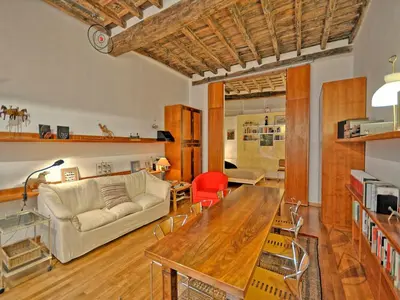 a living room with a couch and a table at Terrace Governo Vecchio in Rome