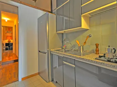 a kitchen with a stainless steel refrigerator and a sink at Terrace Governo Vecchio in Rome