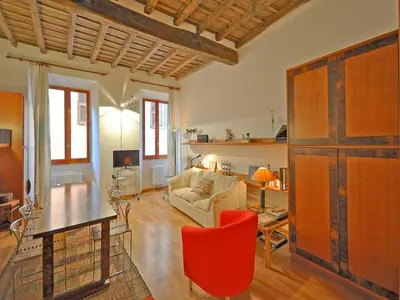 a living room with a couch and a table at Terrace Governo Vecchio in Rome