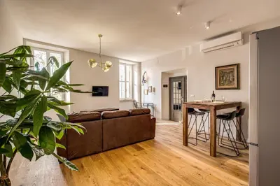 a living room with a couch and a table at Sant'eiligio loft campo di fiori in Rome