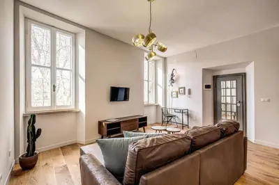 a living room with a couch and a table at Sant'eiligio loft campo di fiori in Rome