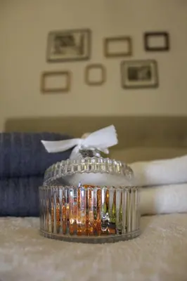 a glass container sitting on top of a table at St. Peter's Luxury Rooms in Rome