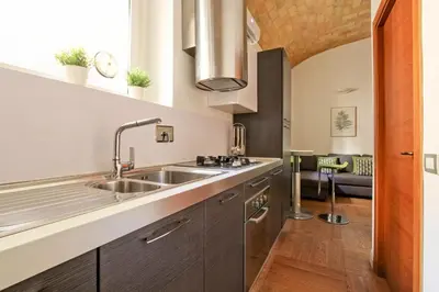a kitchen with a sink and a counter at Maisonette Coppedé in Rome