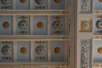 a wall with blue and white patterns on it at Palazzo Caruso in Rome