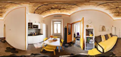 a living room with a couch and a table at A casa di Ale e Lalla in Rome