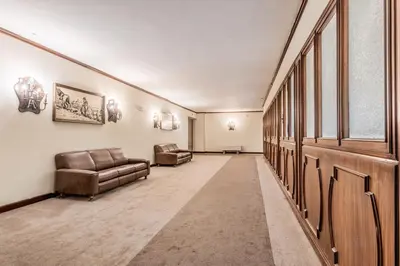 a long hallway with couches and chairs in a building at Il Nido di Lulu in Rome