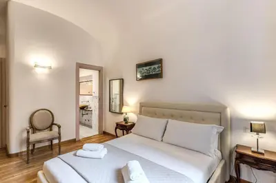 a bedroom with a bed with two towels on it at Biancalunagiulia in Rome
