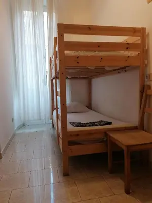 a bedroom with two bunk beds in a room at Varese Guest House in Rome