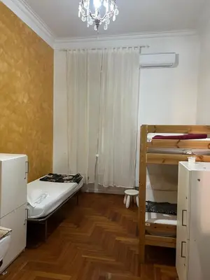 a bedroom with a bunk bed and a chandelier at Varese Guest House in Rome