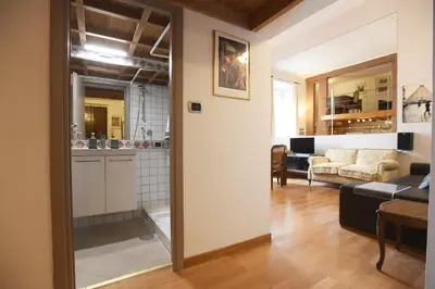 a living room with a kitchen and a living room at Lo Chalet in Rome