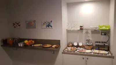 a kitchen with a counter with food on it at PIANETA ROMA 39 in Rome