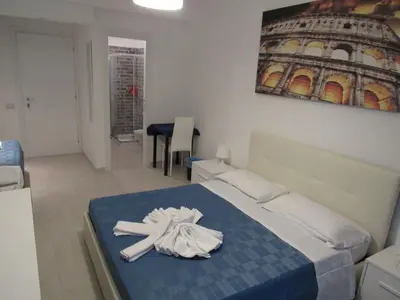 a bedroom with a bed with a towel on it at PIANETA ROMA 39 in Rome