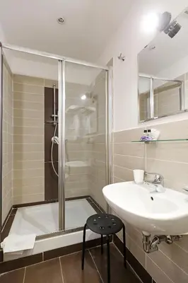 a bathroom with a sink and a shower at Maison Colosseo (Via dei Querceti 24) in Rome