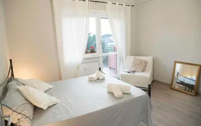 a bedroom with a bed with two towels on it at Green view apartment in Rome
