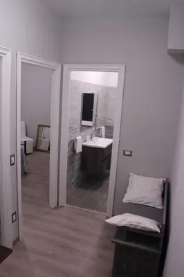 a bathroom with a sink and a mirror at Green view apartment in Rome