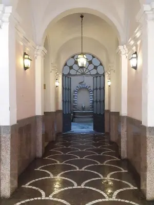 an empty hallway with a large door in a building at La Residenza Suites in Rome