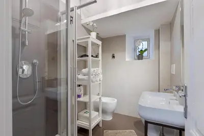 a bathroom with a shower and a toilet and a sink at Urbana Apartment Colosseum in Rome