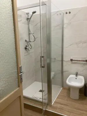 a shower stall in a bathroom with a toilet at GuestHost - Campo De' Fiori Central Flat in Rome