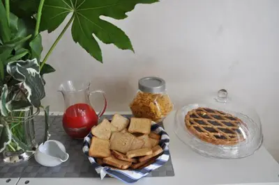 a table with a plate of crackers and a waffle at Bed & Breakfast Agli Horti Sallustiani in Rome